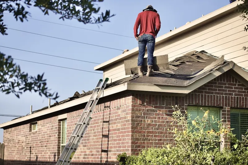 Professional roofer working on a residential roof in Orange Grove Estates